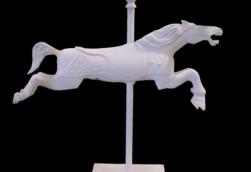 Fiberglass carousel horse sculpture, side view, mounted on a vertical pole with a dynamic leaping pose.