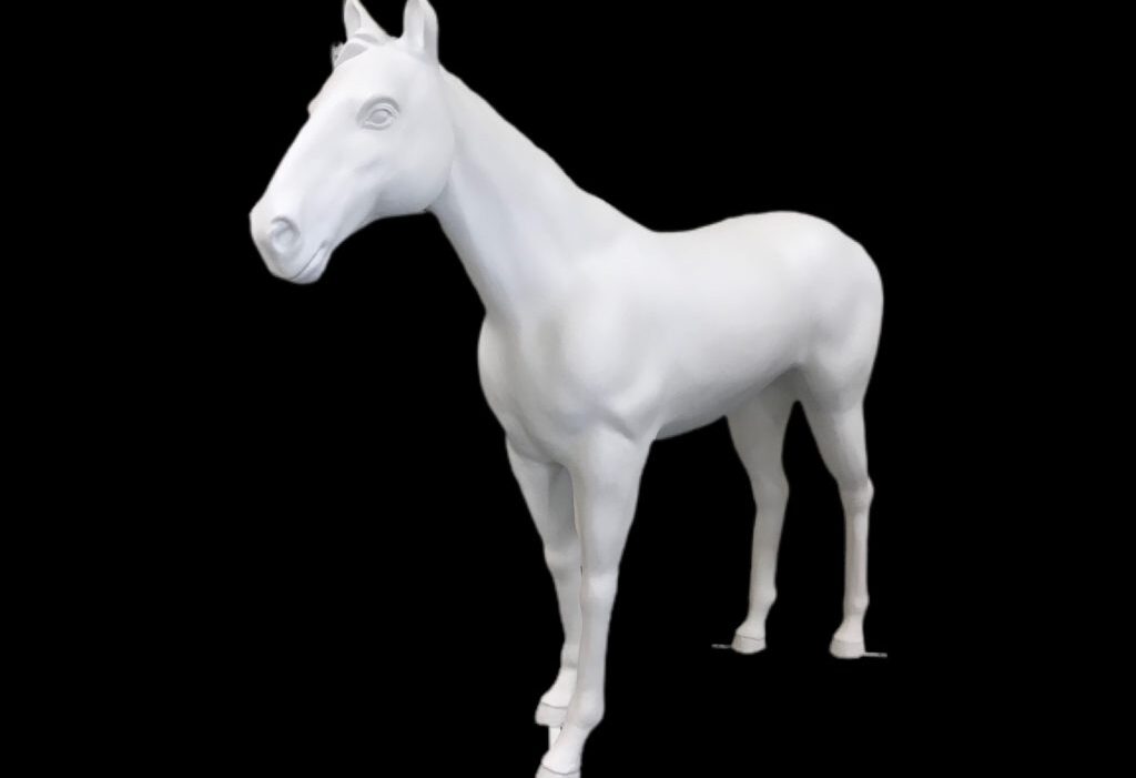 Front angled view of a white fiberglass horse statue against black background.