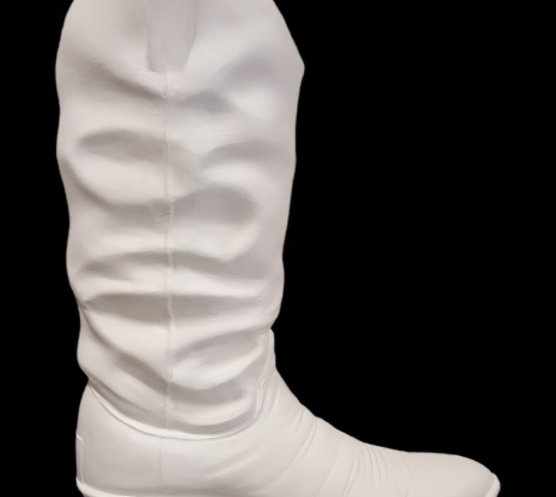 Detailed fiberglass cowboy boot sculpture, side view, without spurs.