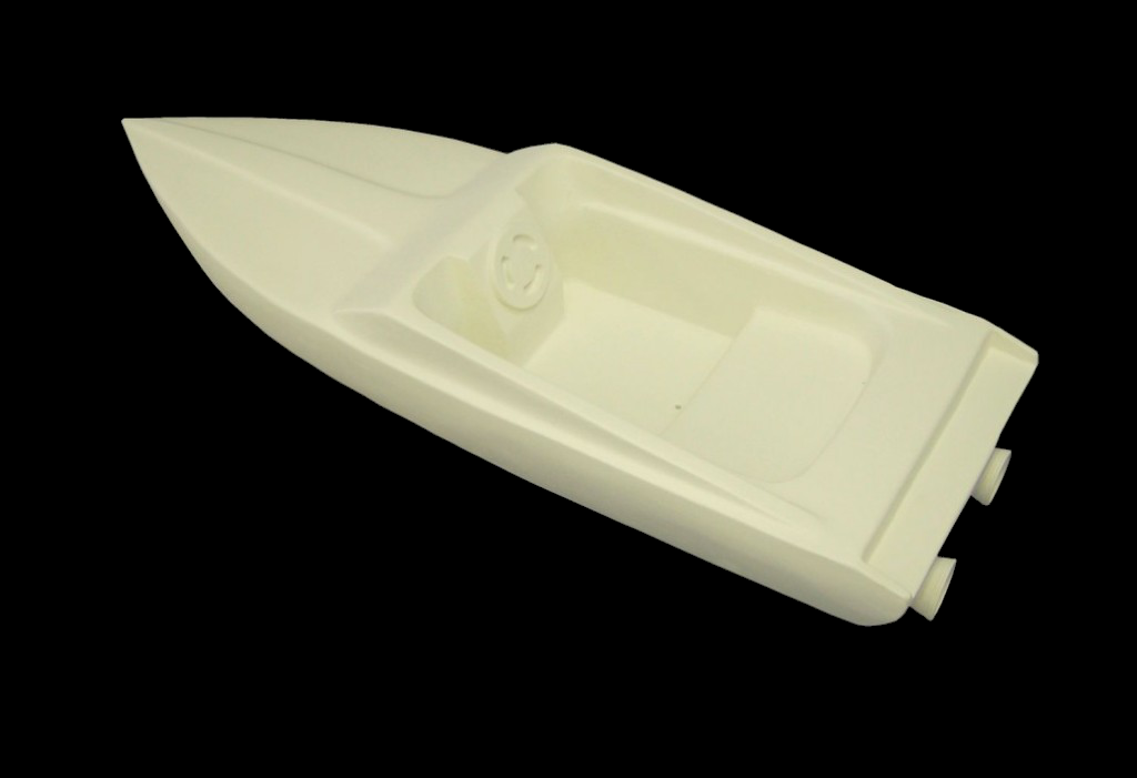 White fiberglass speedboat model with pointed bow, recessed seats, and dual exhausts, shown from an angled top view.